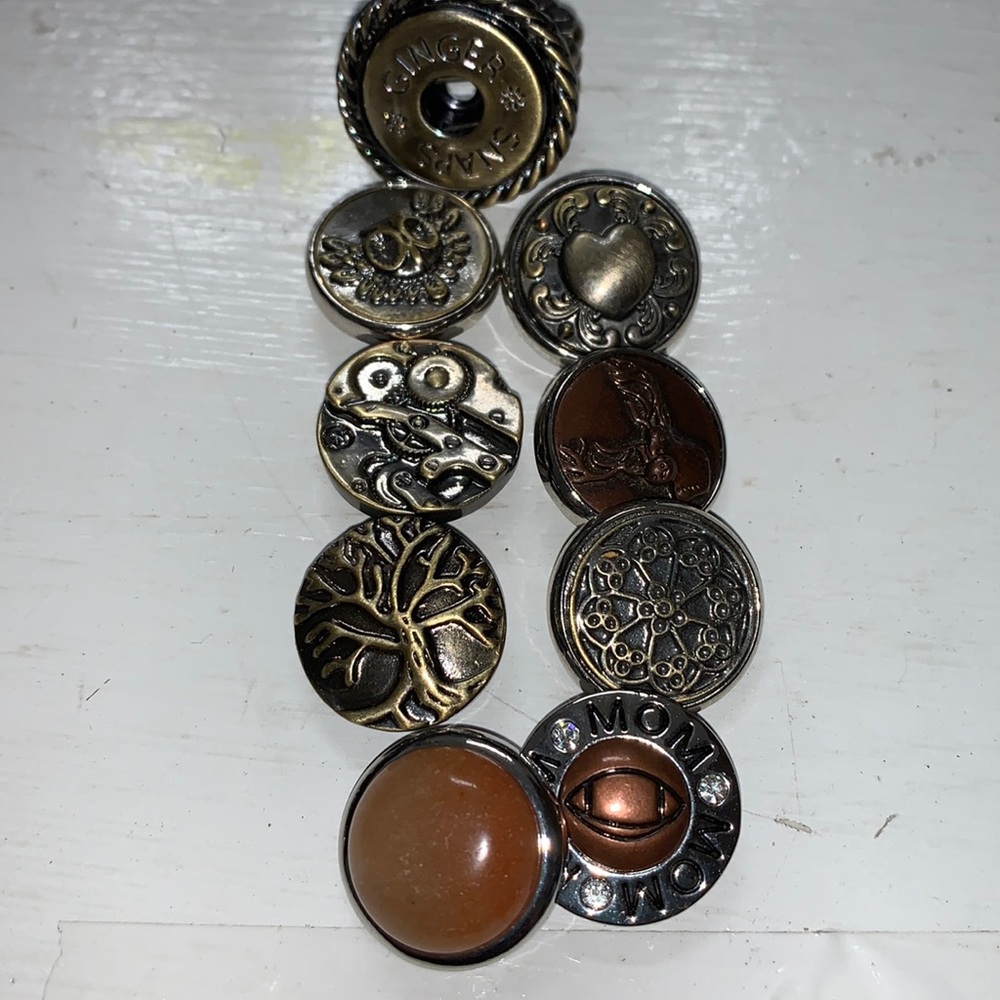 One antique brass stretch band snap ring with 8 snaps.  NWOT.